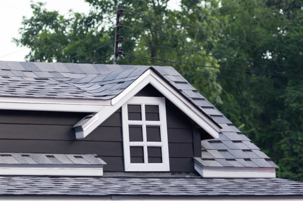 Close up view of shingle roof installation on gable rooftop