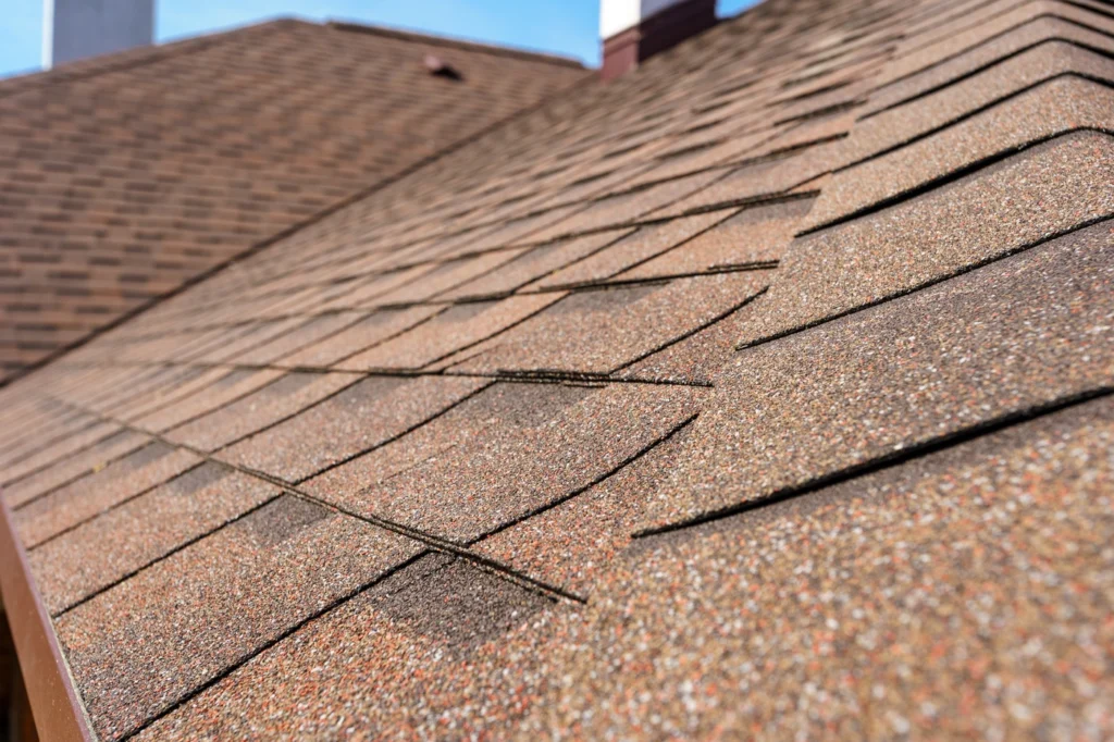 Close-up of light brown roof shingles installed on residential home