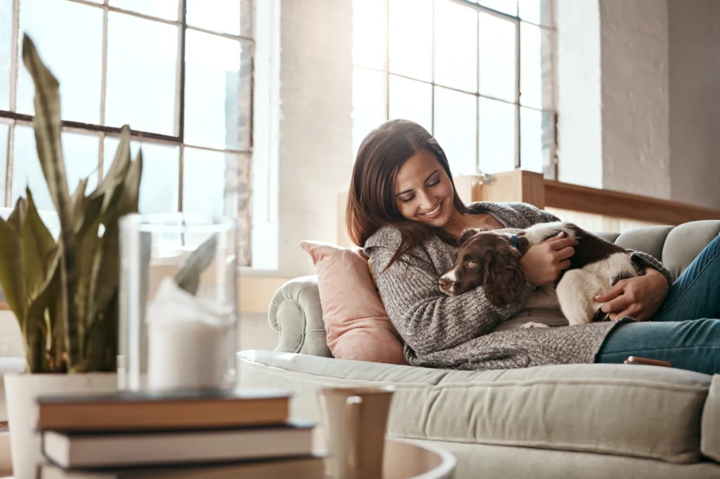 Happy homeowner enjoys time with new puppy at home in Mt Juliet TN
