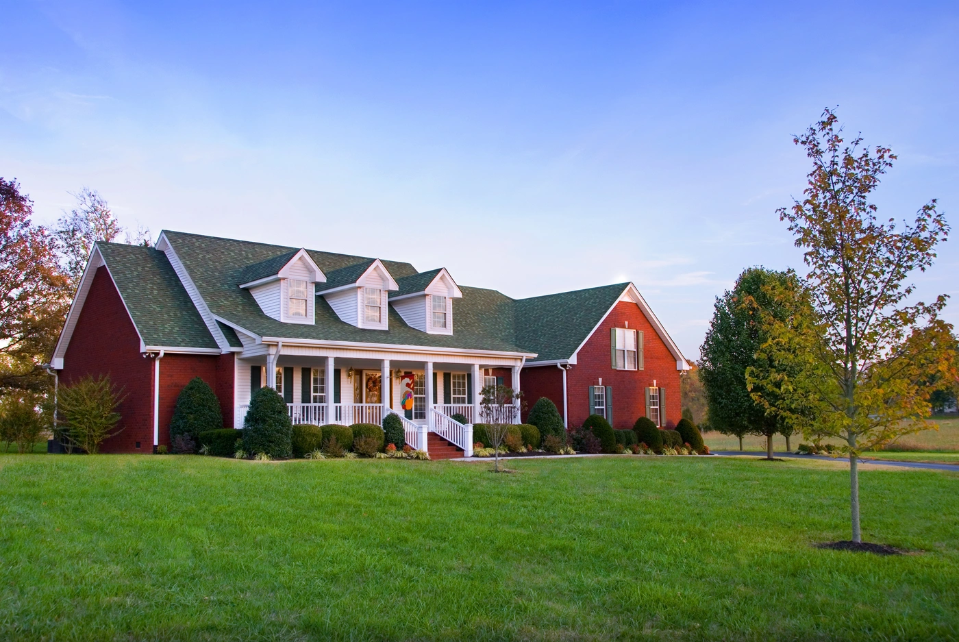 Murfreesboro home in the country with red siding and green shingle roof