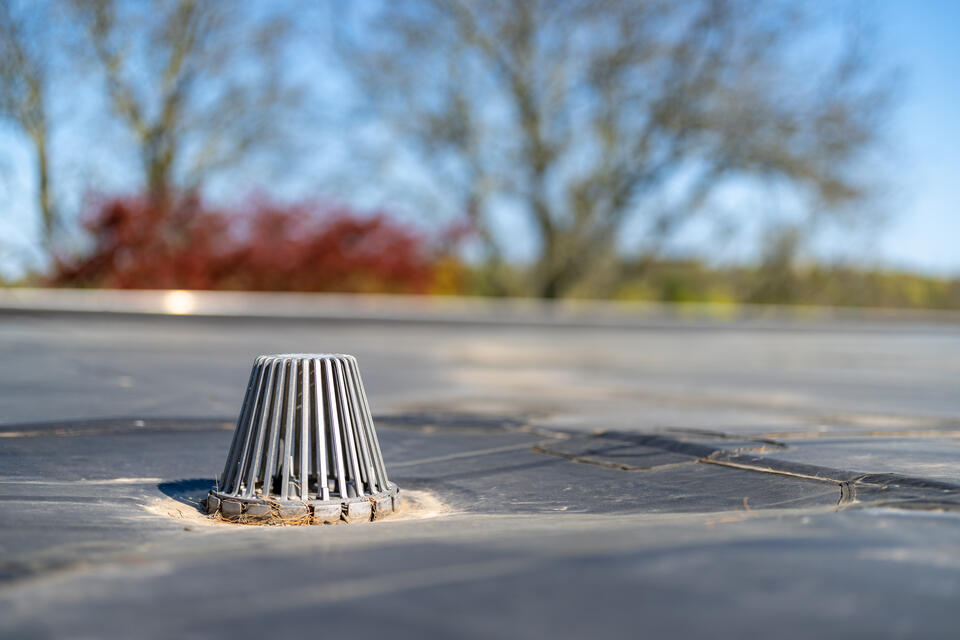 commercial roof maintenance-close up of flat roof drainage system