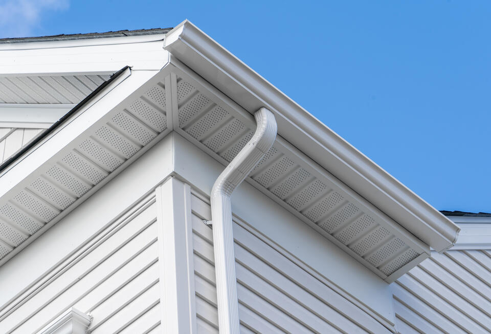 soffit vents-close up view of white soffits and roofing materials