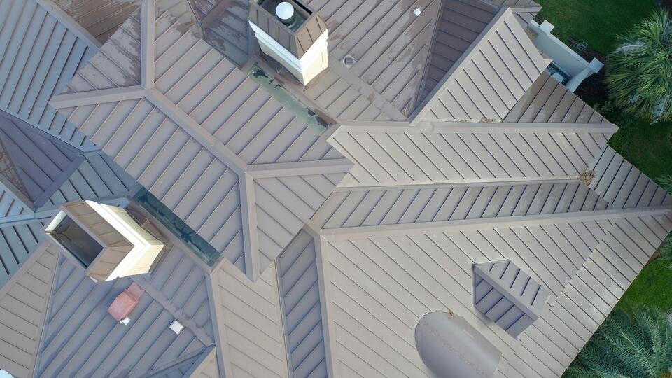 standing seam metal roof-aerial view of a home with gray metal roofing